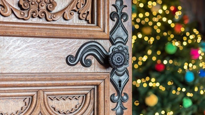 A Christmas tree can be seen behind the door at the library at Penrhyn Castle, Wales.